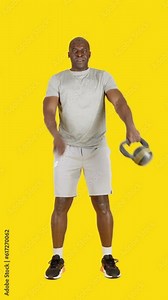 Strong african man doing around the world exercise with kettlebell