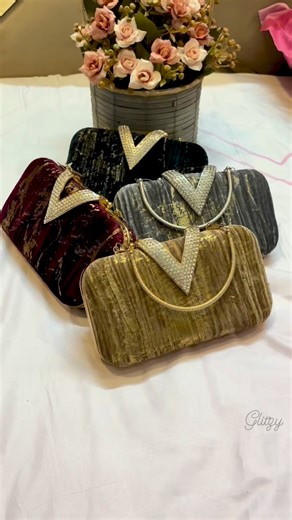Gorgeous and classy looking velvet finished party bag for ladies. Available in 4 beautiful colors #partyclutch #bagsforwomen #partybags #trendyoutfits | Glitzy