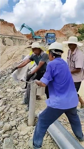 The Tough Process of Installing Highway Guardrails by Hand - Good tools and machinery make work easy