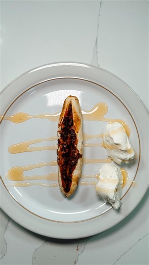 Paddy Watts | 💻Online Coach on Instagram: "Send this to someone who likes bananas Macros 285 calories 16g P | 38g C | 10g F Method 1. Slice a banana down the middle 2. Add a table spoon of peanut butter + sprinkle on some dark chocolate 3. Whack in the air fryer at 200 for 15 mins 4. Optional - add Greek yoghurt or iced cream + honey 5. Devour and enjoy Comment SLAPMAS for 25 high protein Christmas recipes under 500 cals"