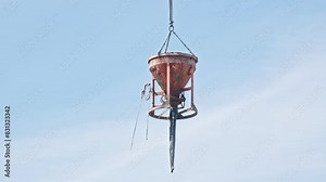 Concrete Funnel Skip for Aiming and Placing Concrete Lifted with Crane over Construction Site