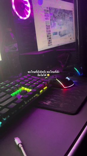 Impressive RGB Computer Setup in Dimly Lit Room