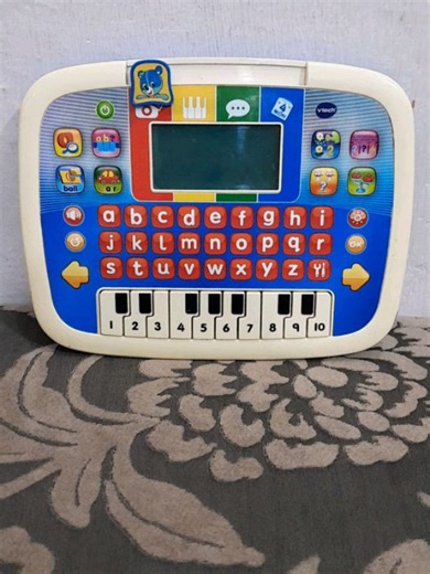 preloved toys on Instagram: "VTech Little Apps Tablet , an educational toy designed for young children. It features a light-up screen, A-Z keyboard, piano keys, and various activity buttons. It includes 12 learning activities that teach letters, words, numbers, counting, basic math, and music. The tablet is portable and designed for hands-on learning, with features like volume control and automatic shut-off. It is intended for ages 2–5 years. Price 2950"