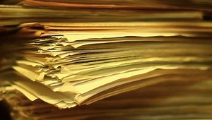 Stacks of old papers, old office documents, old paper work.