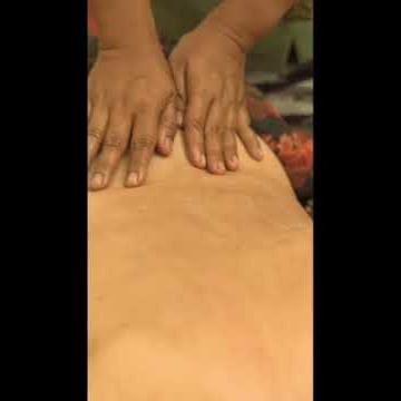 In-room massage with a relaxing rain ambience
