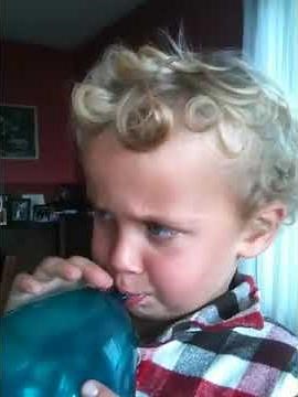 Kid Blowing up Balloon