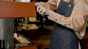 Close-up hand Asian woman shop owner, who is working as barista in own cafe, is bringing machine that contains pre-ground coffee assemble coffee maker, making menus according customer orders. Stock Video