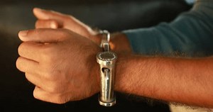 clip-3452049393-male-criminal-hands-police-handcuffs