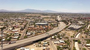 Tucson, Arizona, USA - May 28, 2022: Traffic passes on the 10 Freeway as it winds through the South Tucson neighborhood.