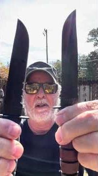 Ka-Bar Short Fighting/ Utility Knives Leather Stack and Kraton Handle Thrown Side By Side in Board