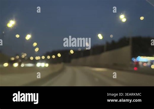 Night driving on a dark highway with blurred taillights, passing cars, and a moody low-light atmosphere captured from inside a moving vehicle. High quality FullHD footage Stock Video Footage - Alamy