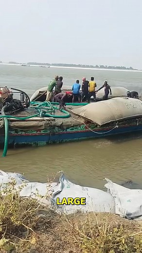 Dumping Sandbags for River Protection. #RiverProtection #SandbagDumping #FloodSafety #ErosionControl #ShipOperation | Doraya Jennings
