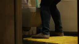 Problems of the male genitourinary system A man in the toilet with...