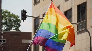LGBT community flag flies in slow motion at the Christopher street day parade