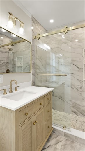 Mike & Jackie | NOVA Full Service Home Design & Build on Instagram: "From dated to dreamy ✨ Watch this bathroom get a whole new life. #kitchenandbath #bathroomrenovations #bathroombeforeandafter #bathroomtransformation"