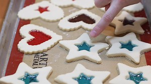 Learn how to make stained glass cookies at home. These are perfect for Christmas, you can also make them into edible ornaments for your Christmas tree. #stainedglasscookies #christmas #christmascookies | In The Kitchen With Matt