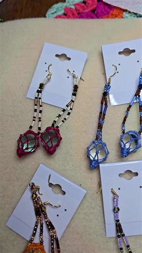 Beaded glass ball earrings. First I dye the thread, create the base to make the knots off of, wrap it in thread. then make the knots for rhe balls, then glue them in place before beading. Love colors. #glassballearrings #beadedearrings #alaska #glassballs