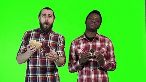 Man eating burgers and watching - Free Stock Video