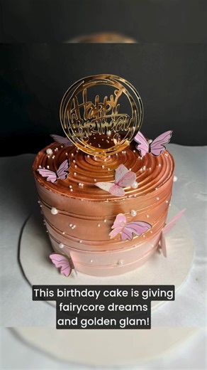 Golden shimmer, fluttering butterflies, and delicate pearls — this dreamy birthday cake is straight out of a fairytale! 💖✨ Crafted with elegance, love, and a whole lot of sparkle, it’s perfect for making your special day extra magical. 🦋🎉 Because birthdays deserve a little bit of butterfly magic! . . . . . {butterfly cake, shimmer cake, pastel birthday cake, elegant celebration cake, fairycore cake, golden birthday cake, luxury birthday cakes, birthday cake design, custom cakes Gurugram, écla