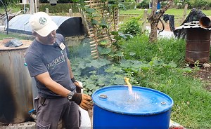This step-by-step video demonstrates the build-out of a simple biochar kiln for the pyrolysis of rice hull/rice husk waste. This particular design uses a 200L barrel and a small fan for improved airflow. . Our team regularly uses this kiln design for the pyrolysis of rice hulls (an abundant waste resource in our region) which we then mix into our nursey potting mixes. . If you need to back up one step and watch our 'How to Build a Basic TLUD (Top-Lit-Up-Draft) Biochar Kiln' you can view it using