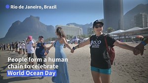 14 reactions | Thousands 'hug' the ocean on Brazil beach About 2000 people made a human chain on Rio de Janeiro's Sao Conrado beach on Thursday to celebrate World Ocean Day. | AFP News Agency | Facebook