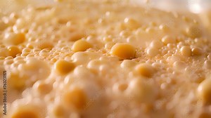 A closeup of the extrusion disc with small holes used to create intricate and textured pasta shapes.