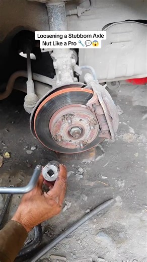 Loosening a Stubborn Axle Nut Like a Pro 🔧 😱 Loosening a Stubborn Axle Nut Like a Pro 🔧 The axle nut was completely seized — regular tools weren’t enough. Using a heavy-duty socket and a breaker bar, the nut finally cracked loose smoothly. Right tools, clean results. ⚙️ #mechanic #repair #auto #viral #fyp