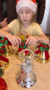4.2M views · 48K reactions | Don't grab the Wrong Bell  Family and kids play fun holiday table game with christmas bells, for prizes and punishments instead of stockings. (for entertainment purposes only) | Benson Bros | Facebook