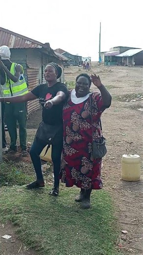 Happy market 5 traders celebrate the successful solar lighting project completion in Homa Bay.