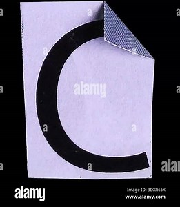 alphabet of a letter c from paper on black background Stock Video Footage - Alamy