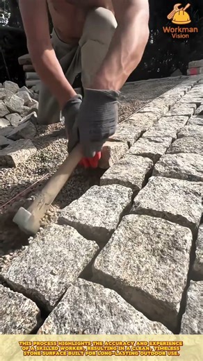 Precision Stone Alignment Process by Skilled Worker Laying Natural Paving Blocks