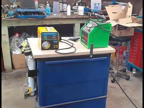 Vehicle smoke machine leak detector tester diagnostic equipment under test.