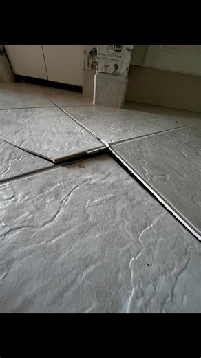 Is this happening in your home. “Tenting” can be caused by multiple situations such as foundation shifts, extensive water absorption, and extreme temperature shifts. But most commonly, poor installation methods. This can be a costly repair and more importantly a dangerous mistake. even in the smallest of areas. With proper materials and advanced techniques This damage can most likely be preventable. Thus the reason you should always hire a knowledgeable and well informed tile installer. Contact 