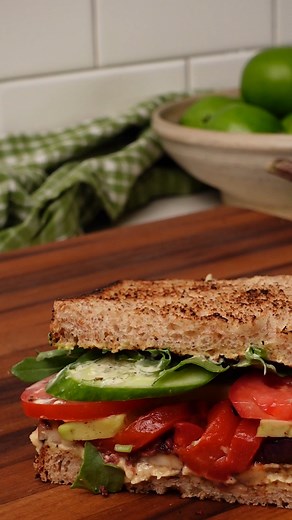 7.8K views · 30 reactions | This vegetarian club sandwich—piled high with hummus, grilled veggies, avocado, roasted red peppers and a tangy mayo spread—might be the best sandwich you’ll ever have. Taking time and care with each component—like getting a nice char on the eggplant—is the secret to this standout sandwich. Get the recipe: https://bit.ly/3YUBLGw | EatingWell | Facebook