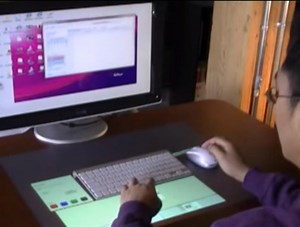 Magic Desk: Bringing Multi-Touch Surfaces into Desktop Work