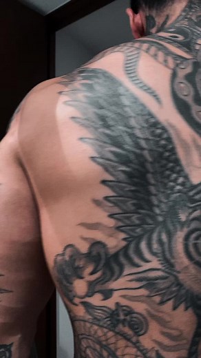 Discover Stunning Tattoo Art on a Muscular Male Model