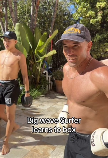 Big Wave Surfer Tries Boxing Moves with Slim Reaper