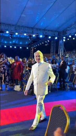 pastor benny hinn arrives at the crusade