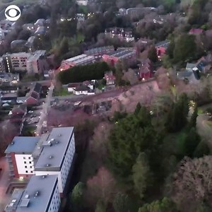 A World War Two bomb found in southwestern England was detonated on Saturday in a controlled explosion. Drone footage shows a large cloud of smoke rising near buildings as the bomb was detonated. | CBS News