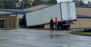 Tractor trailer crashes into Monroe Tractor on Genesee Street