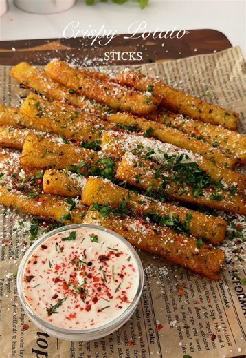 Crispy Potato Sticks Crispy outside, soft inside and so addictive. Recipe: • 500 g potatoes • 3 tbsp cornstarch • 1 tsp garlic powder • Fresh parsley • Salt & black pepper Boil and mash the potatoes. Mix with cornstarch, parsley and seasonings. Spread into a thin layer and freeze for 1 hour. Cut into sticks and fry in hot oil until golden and crispy. Top with parmesan, parsley & chili flakes 🤍 #potato #potatorecipe #crispyfries #easyrecipe #foodtok