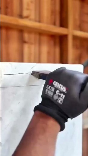 Stone cutting process using a chisel and hammer