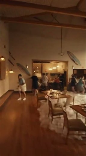 Wave Crashes Through Restaurant Window