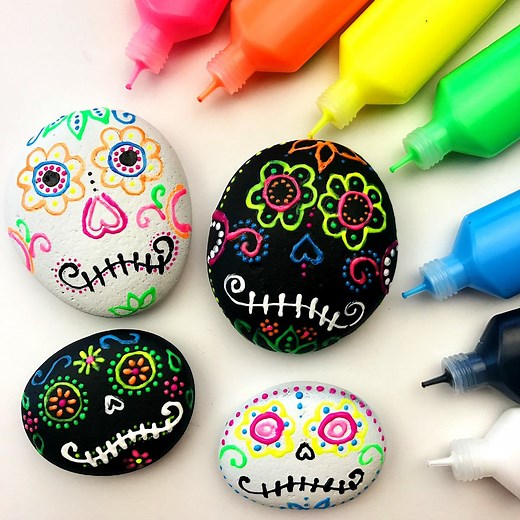 Did you know you can use puffy paint on rocks? But not all puffy paint is created equal. Learn what works best and how to make these sugar skull rocks here--> https://colormadehappy.com/sugar-skull-rocks-using-puffy-paint/ | Color Made Happy
