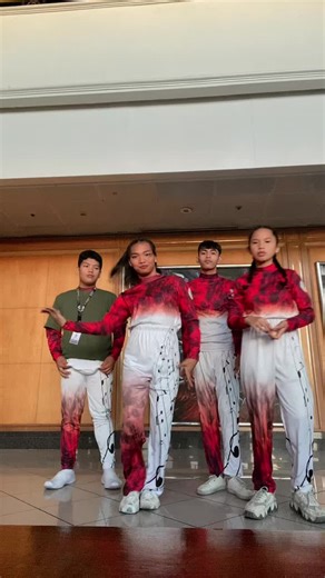 Synchronized Dance Performance with Red and White Theme