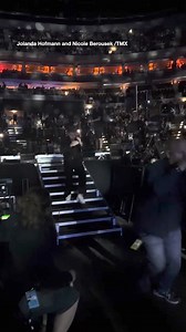 Nick Jonas was seen issuing a signal to his bodyguards as he fled the stage. | news.com.au Entertainment