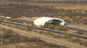 Aerial over a U.S. Border Patrol and Customs checkpoint along a highway in Arizona.
