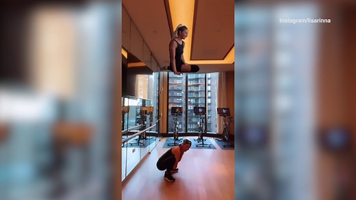 Lisa Rinna stretches before sweating through an intense, cardio heavy workout