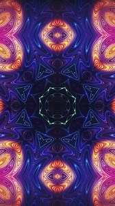 Download Vertical video - ornate glowing mandala styled kaleidoscopic background. This vibrant, colorful, hypnotic geometric background animation is full HD and a seamless loop. for free