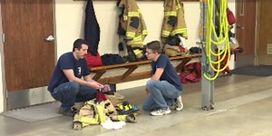 Fire fighters show students the ropes